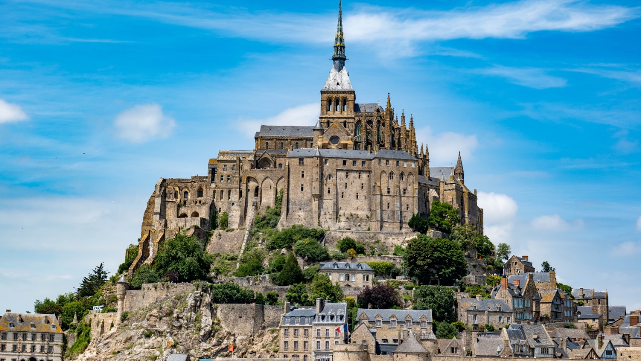 Mont Saint-Michel, France is a breathtaking destination known for its iconic silhouette and stunning architecture. This small rocky island, located just off the coast of Normandy, showcases a perfect blend of