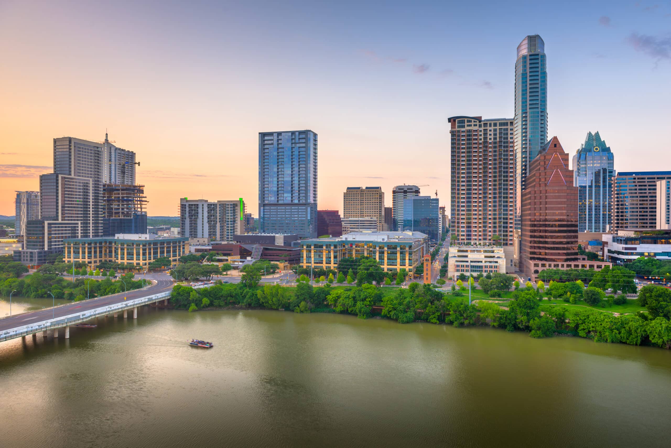 Austin, Texas, USA downtown city skyline on the Colorado River at dusk.